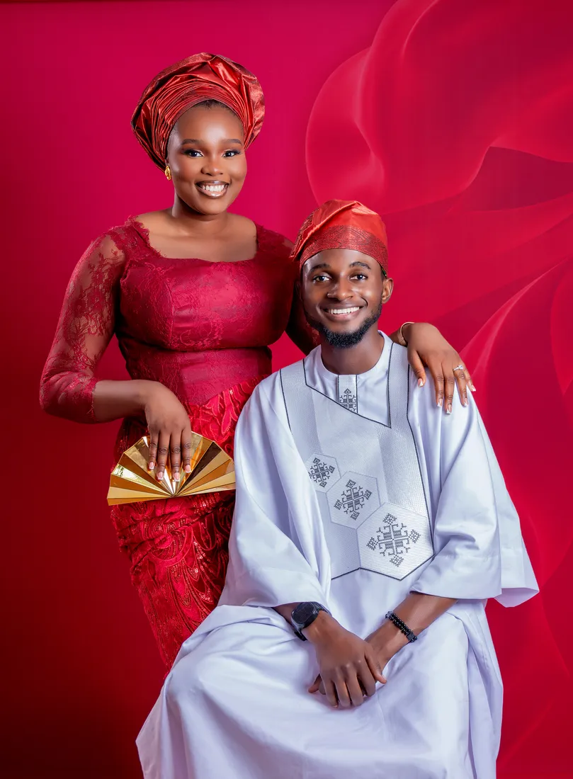 Precious and Michael in their wedding colours